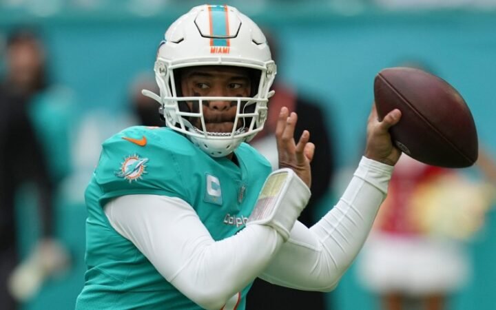 Miami Dolphins quarterback Tua Tagovailoa (1) looks to pass during the first half of an NFL football game against the Green Bay Packers, Sunday, Dec. 25, 2022, in Miami Gardens, Fla.