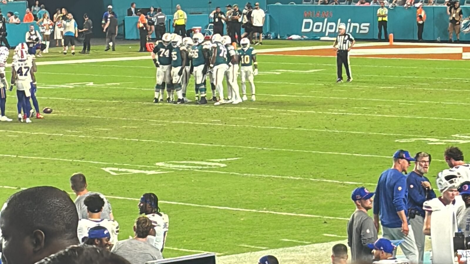 The Miami Dolphins offense huddle before a play against the Buffalo Bills