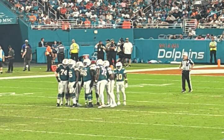 The Miami Dolphins offense huddle before a play against the Buffalo Bills