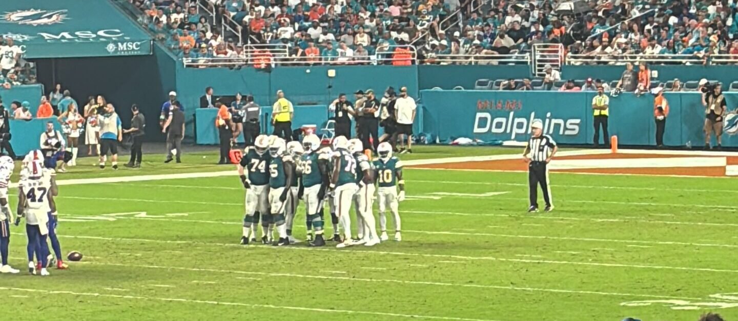 The Miami Dolphins offense huddle before a play against the Buffalo Bills